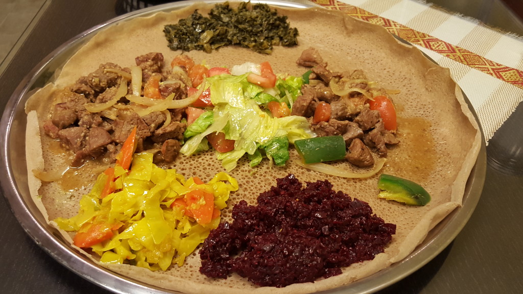 Lamb tibs with an assortment of colorful veggies at Ribka Ethiopian Cuisine.