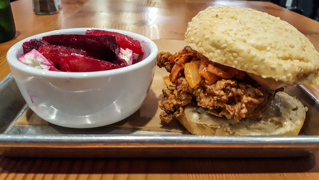 The fried chicken kimchi sandwich, with a side of beets, at Farmboy Kitchen.